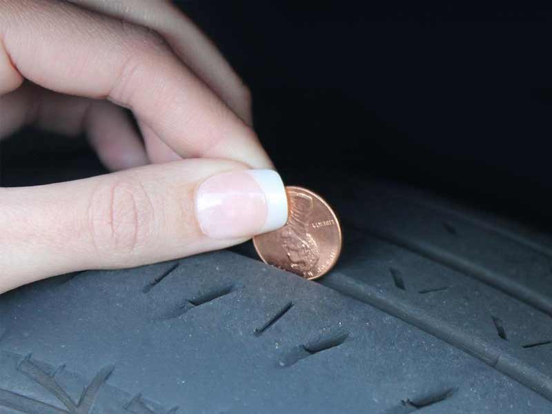 How to check tire tread with a penny?